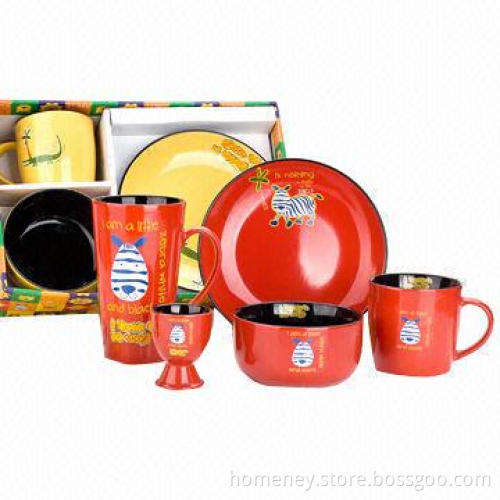 Ceramic mug, bowl and plate with colored glaze of red and yellow